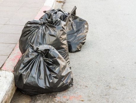 Rubbish removal team in Hampstead collecting waste