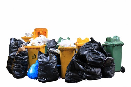 Workers sorting construction waste for recycling in Hampstead