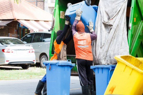House clearance team sorting items in Hampstead home